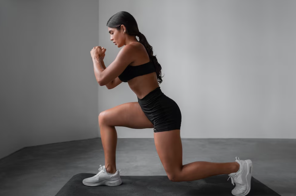 Women in shorts and top doing exercise