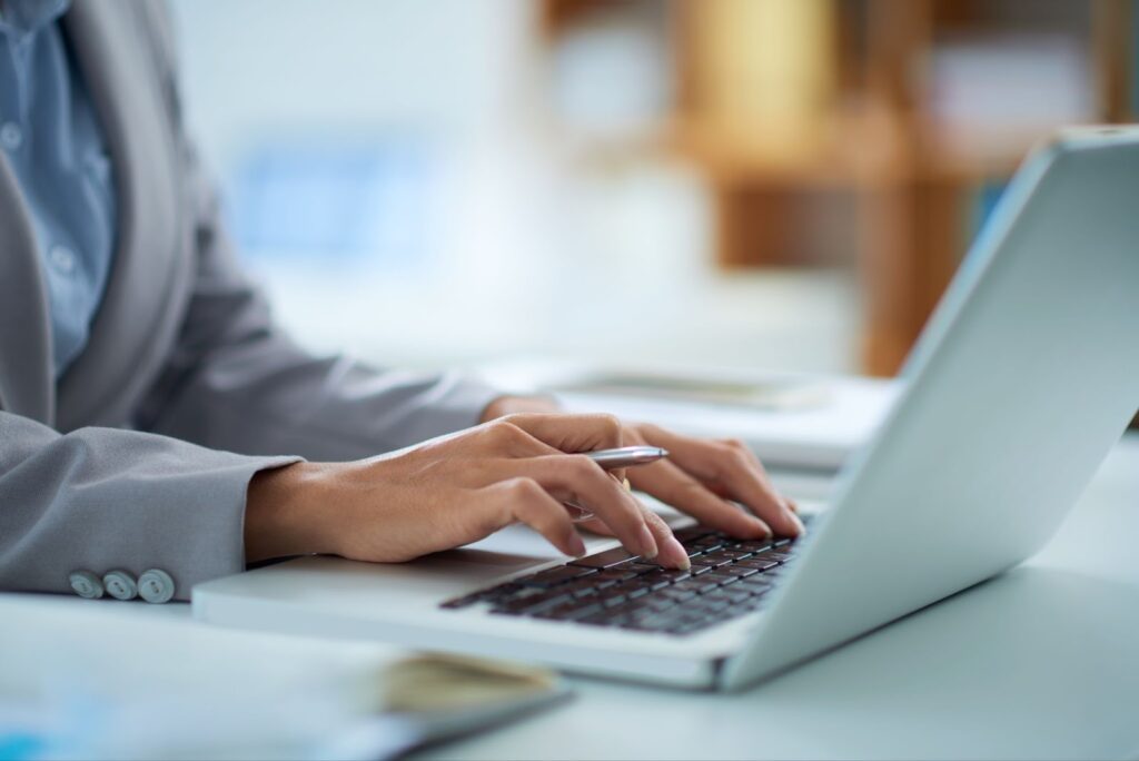 Close up of woman working on laptop