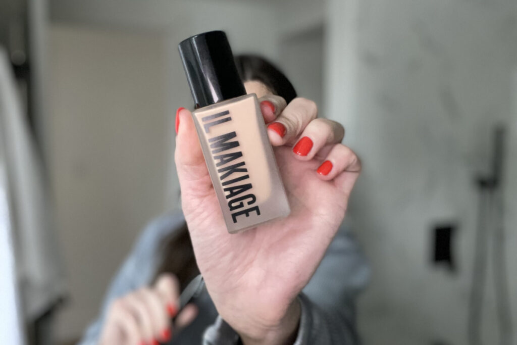 Girl holding facial cosmetics in her hand